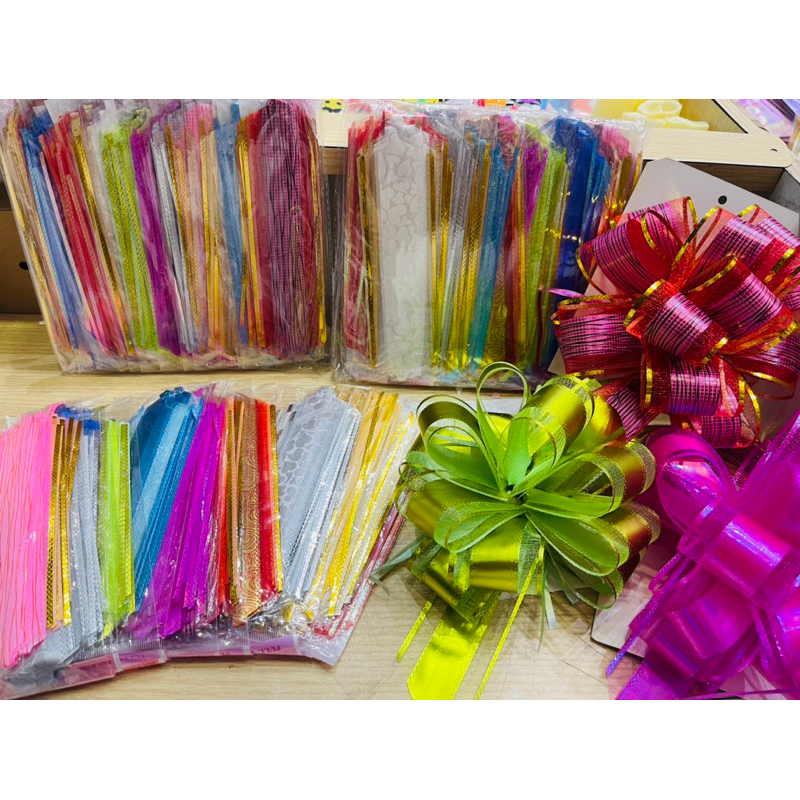 ดอกริบบิ้นคละสี โบว์ปีใหม่ ติดของขวัญ แบบดึง(1แพค 12ชิ้น)