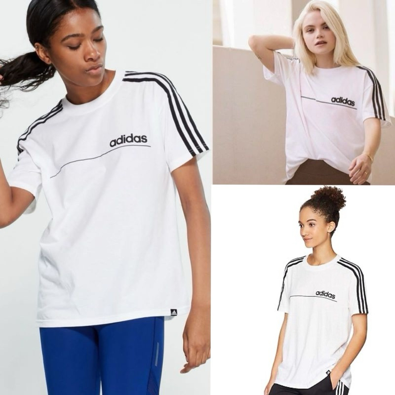 เสื้อยืดแขนสั้นทรงคอกลมสีพื้นผ้าคอนตอน ด้านหน้าเป็นงานปักโลโก้ ขอบแขนแต่งแถบสีขาว
