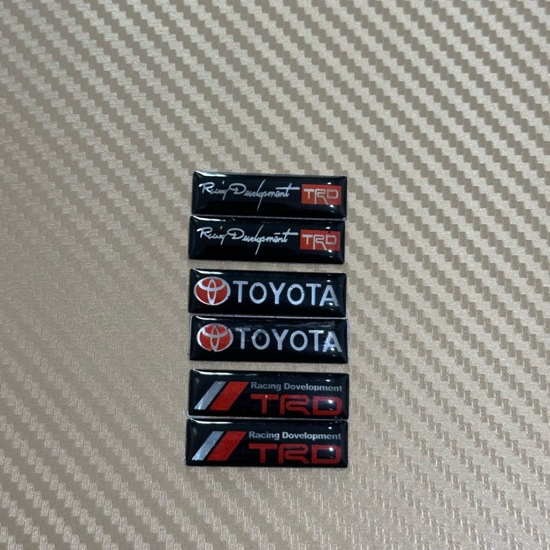 สติ๊กเกอร์ลาย Toyota ตัวเล็กคู่ ( ขนาด 1 x 3.4 cm ) เป็นงานเรซิ่นตัวนูน ราคาต่อคู่