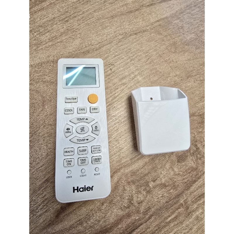 รีโมทแอร์ไฮเออร์รุ่นปุ่มส้มสำหรับเปิด,ปิดของแท้ มีฟังค์ชั่นcool fan dry พร้อมที่ใส่รีโมทติดผนัง 0010401715P