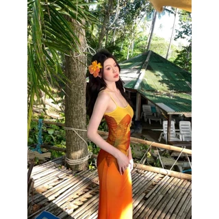 Cicishop(Y6269) เดรสยาวสีเหลืองอมส้ม สายปรับได้ ผ้าซีทรูมีซับใน พิมพ์ลายดอกข้างตัว สไตล์สาวฮาวาย