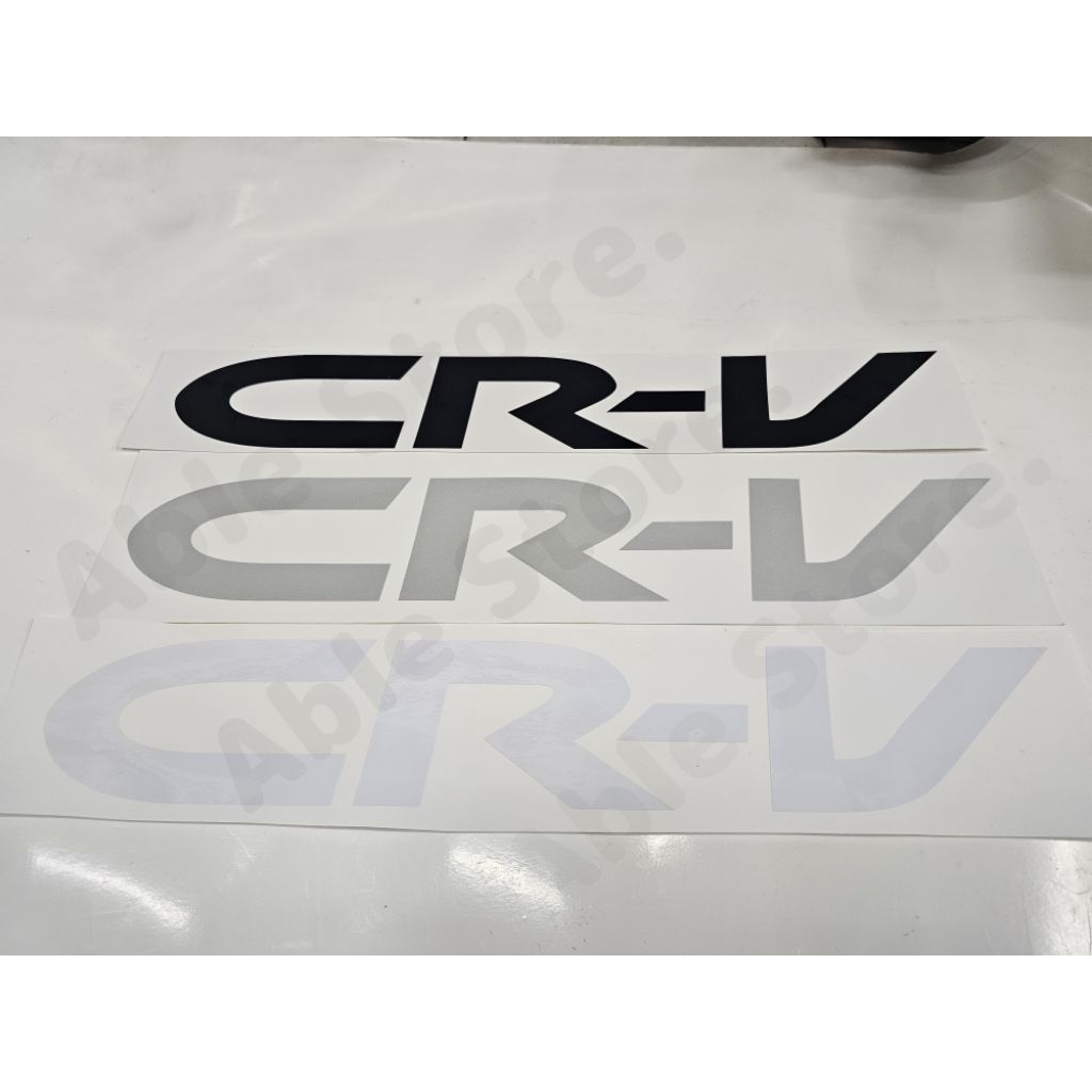 สติ๊กเกอร์งานตัดคอมฯครอบยางอะไหลคำว่า CRV สำหรับติดฝาครอบยางอะไหล่รถฮอนด้าซีอาร์วี HONDA CRV มี 3 สี