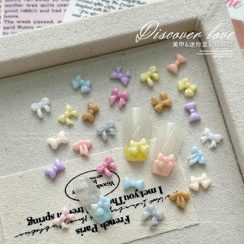 100 PCS 3D โบจิ๋ว สีแดง Hollow Bow ตกแต่งเล็บ Charms อุปกรณ์เสริมตัวอย่าง Bowknot สําหรับตกแต่งเล็บเล็บ
