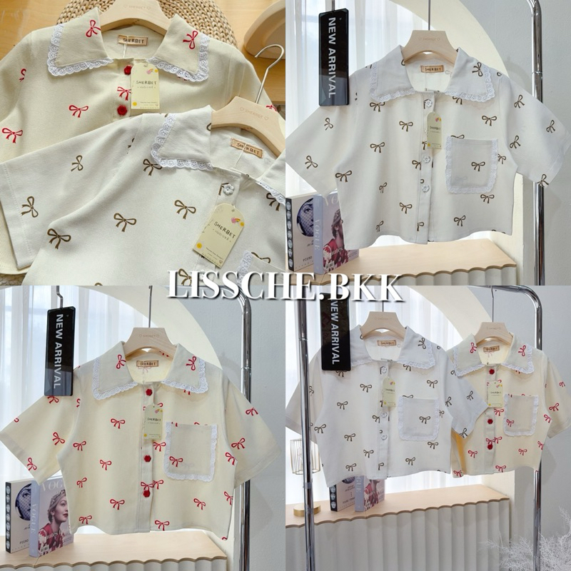 “SHERBET” เสื้อยีนส์คอปกเชิ้ต ผ้ายีนส์แท้พิมพ์ลายโบว์ ระบายขิบลูกไม้คิปกและกระเป๋า