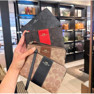 กระเป๋าคล้องมือ รุ่น Corner Zip Wristlet In Signature Canvas มีสีให้เลือก