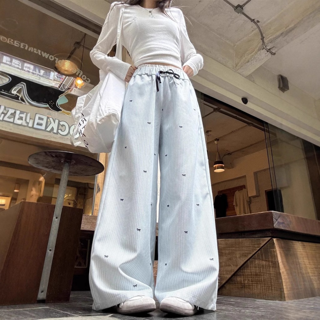 กางเกงขายาวผู้หญิง กางเกงขายาวลายทาง ทรงขาบาน พิมพ์ลายโบว์สีน้ำเงิน