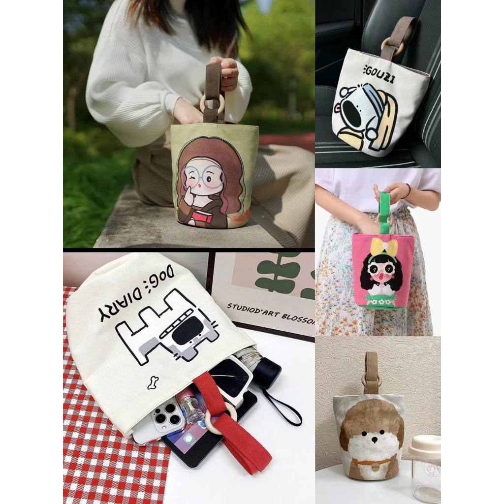 【NEW] กระเป๋าสะพายไหล่ กระเป๋าถือ ทรงบักเก็ต ผ้าแคนวาส พิมพ์ลายการ์ตูนน่ารัก ความจุขนาดใหญ่ ใช้ซ้ําได้ สําหรับสตรี