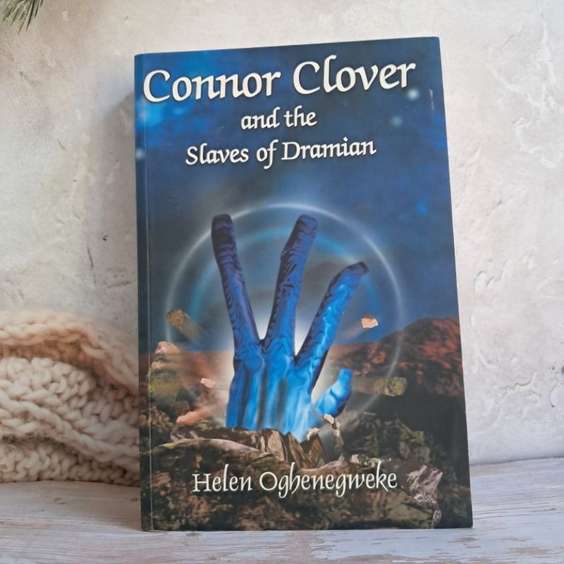 #มือสอง นิยายผู้ใหญ่ Connor Clover and the Slaver of Dramian. By Helen Oghenegweke