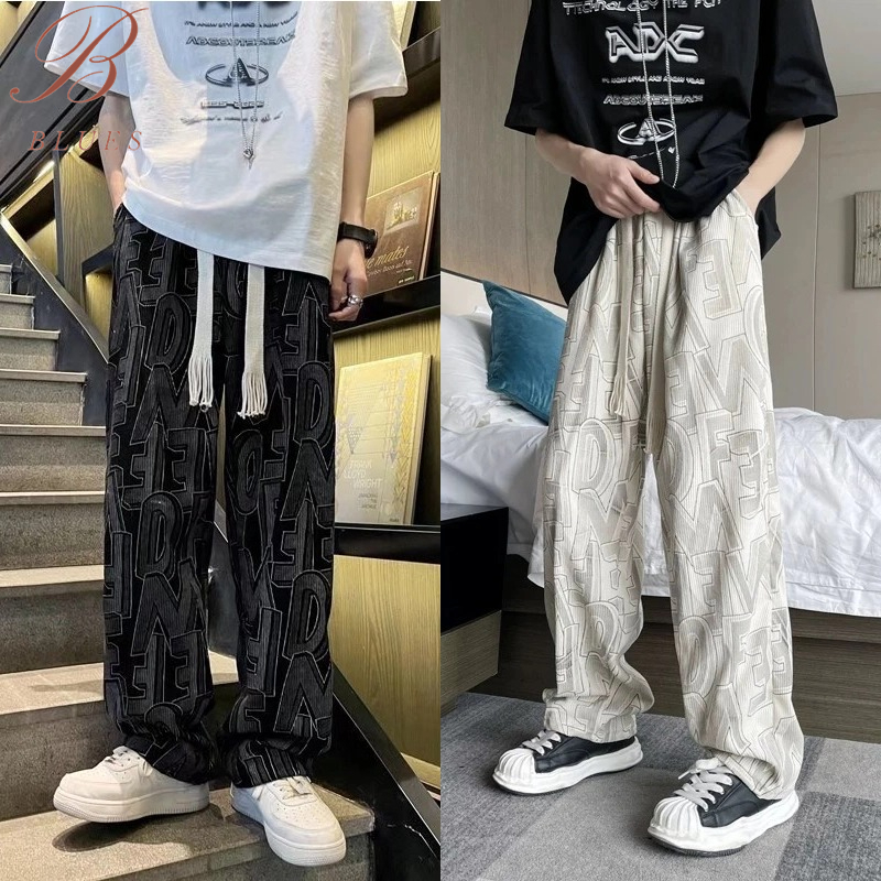 B BLUES กางเกงลูกฟูกขายาว กางเกงผู้ชาย เอวยางยืด พิมลายตัวอักษร แต่งเชือกขาดๆ ใส่เที่ยวชิลๆ ได้ลุคเท่ๆ สไตล์เกาหลี