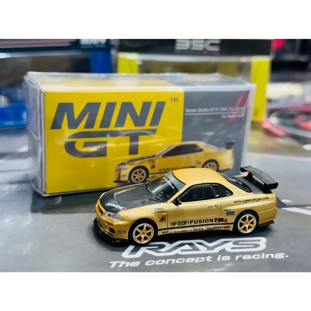 Model Car MINI GT Nissan Skyline GT-R R34 Top Secret Top Secret Gold Japan Exclusive 1/64 รถของเล่น 