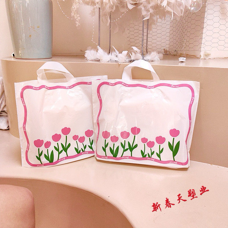 ถุงชอปปิ้ง ถุงแฟชั่นหูเทปลายดอกทิวลิปสีชมพูน่ารักน่าใช้(แพ็คละ50ใบ พร้อมส่งค่ะ)