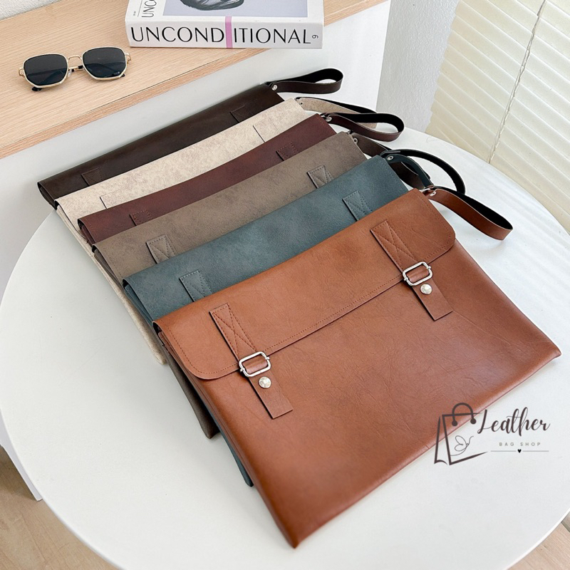 กระเป๋าหนัง ใส่เอกสาร รุ่นใหม่ มีซิปพร้อมกระดุมฝาปิด มีซับในบุกำมะหยี่ กันน้ำได้ ขนาดA4 (10x14)