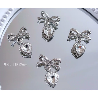 โบว์ห้อยเพชรหัวใจ สำหรับแต่งเล็บ งานอลังเพชรตุ้งติ้ง 10 ชิ้นต่อแพ็ค