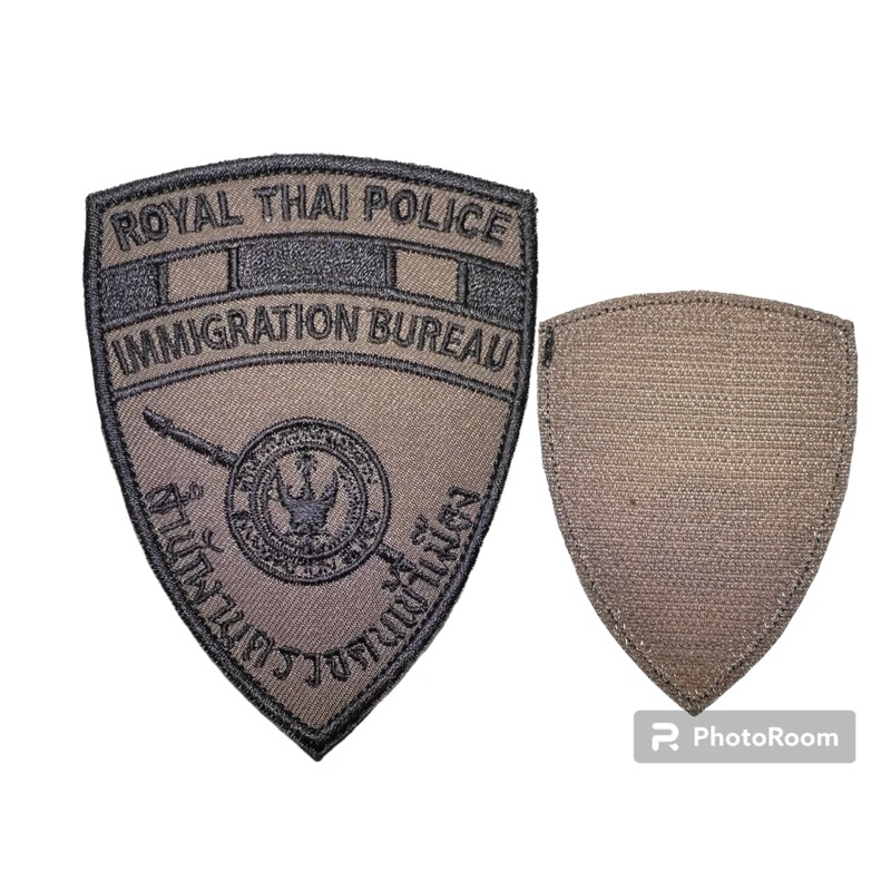 ป้ายผ้า ตม.แบบตีนตุ๊กแก ตรวจคน-เข้าเมืองผ้าซิกม่า