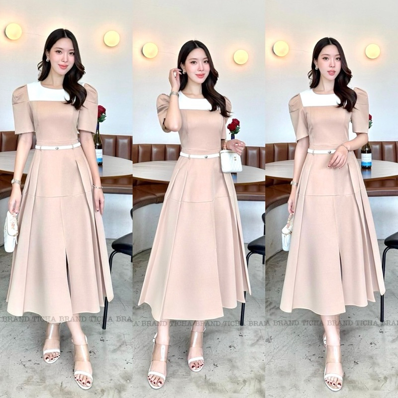 เดรสยาวคอกลมแขนสั้นจับจีบช่วงไหล่ เนื้อผ้าทูโทนช่วงอกสีขาว ด้านล่างลงมาสีน้ำตาลอ่อน