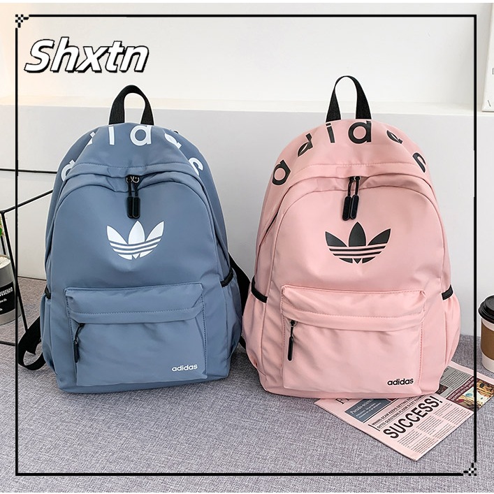 Shxtn กระเป๋าเป้สะพายหลัง Unisex แฟชั่น ผู้หญิงและผู้ชาย กระเป๋าเรียน