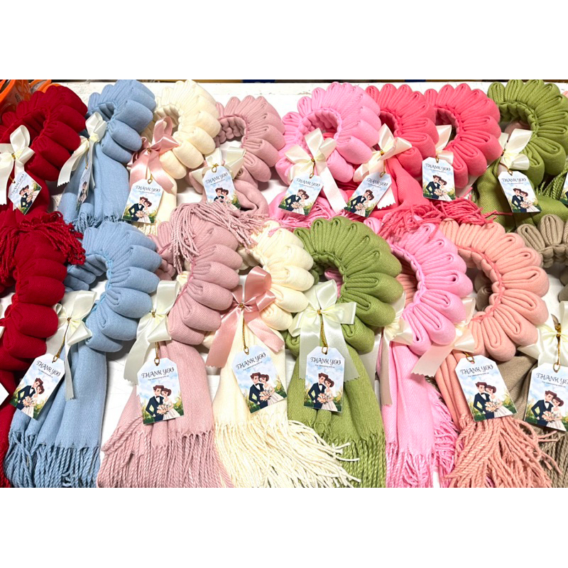 พวงมาลัยสำหรับระบุข้อความที่ป้ายผ้าคลุมไหล่และขาวม้า