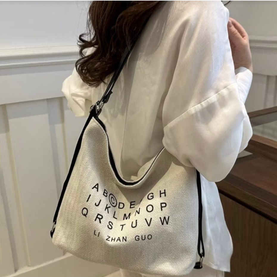 Fashion  กระเป๋าสะพายไหล่ ผ้าแคนวาส  สะพายเป้ได้ สรีนตัวอักษร แฟชั่น  สไตล์เกาหลี   B-911