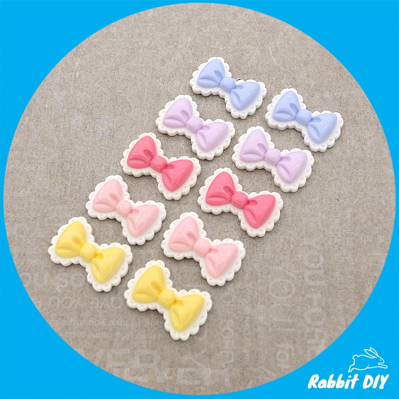 เรซิ่น โบว์ มีหลายสี ระบายขอบสีขาว (แพ็กรวมทุกสี 10 ชิ้น)