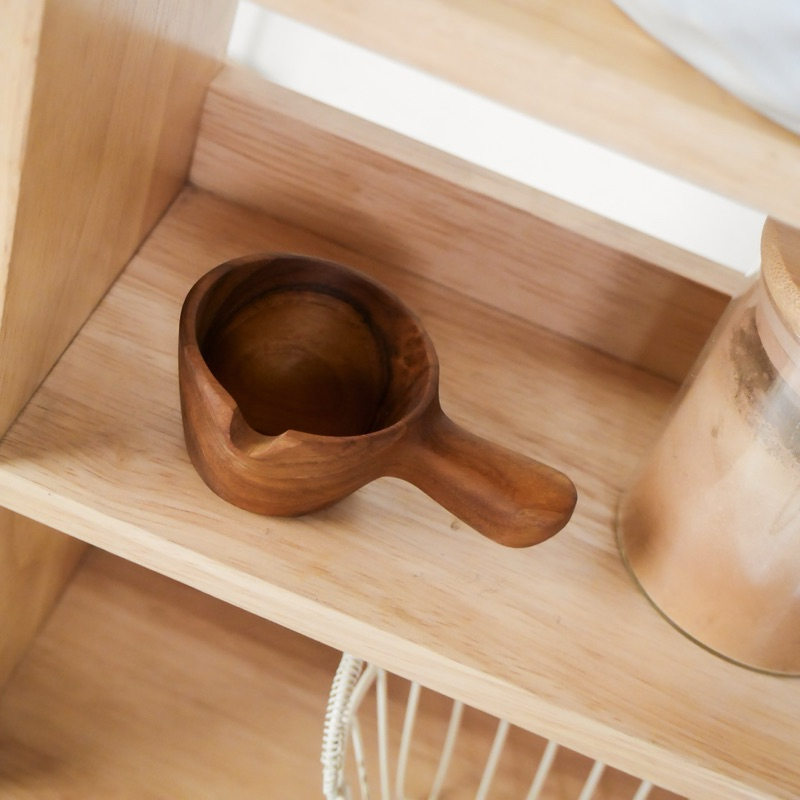 Handcrafted Teak wood measuring cup.