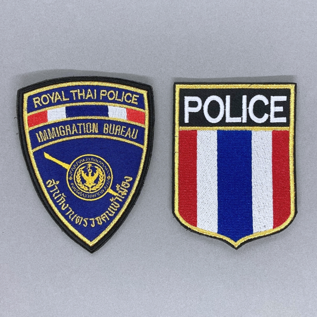 ป้ายแขน สต ม  IM-MIGRATION B. ตราแบบใหม่  มีทั้งแบบติดและไม่ติดตีนตุ๊กแก