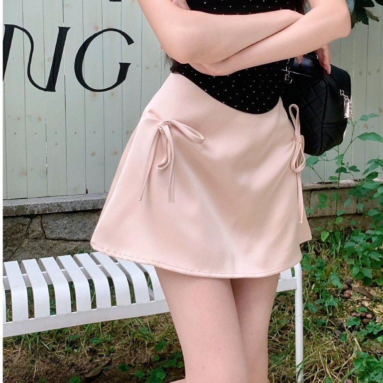 Naughty Bow กระโปรงสั้นผู้หญิงฤดูใบไม้ผลิและฤดูร้อนใหม่เอวต่ำสะโพก Slim A-Line กระโปรง