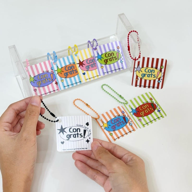 พวงกุญแจCongrats🚀ส่งเร็วมาก🔥(เป็นกระดาษ กันน้ำ ขนาด 2x2 นิ้ว)🙋🏻‍♀️พร้อมส่งจากกรุงเทพ✨🇹🇭