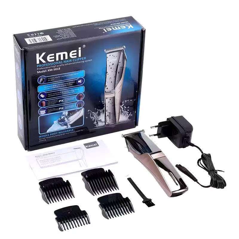 KM-5018 แบตเตอร์เลี่ยนตัดผมไร้สายล้างน้ำได้ ใบมีดไททาเนี่ยม ตัด​คม​ เสียง​เงียบ​ พร้อมหวีรองตัด 4 ขนาด​ อุปกรณ์​ครบชุด​
