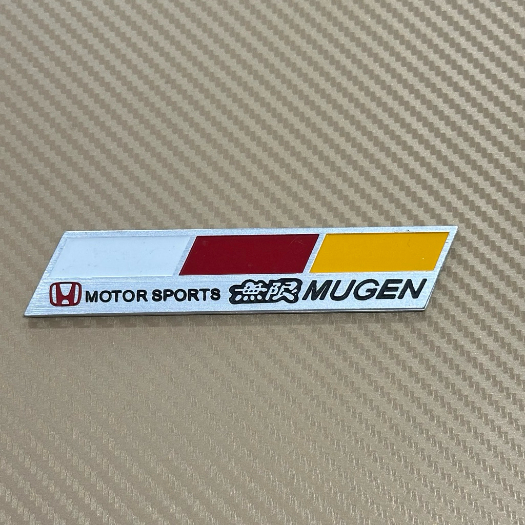 โลโก้ MUGEN เพลท งานอลูมิเนียม ติดรถ Honda ขนาด* 2.5 x 12 cm ราคาต่อชิ้น