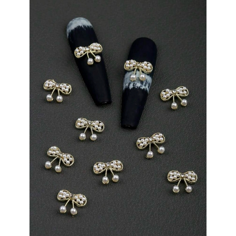 AC.1071 ร้านไทย ขายปลีก 1 ชิ้น พร้อมส่ง งานพรีเมียม อะไหล่แต่งเล็บสีทองรูปโบว์ประดับด้วยมุกแบบทอ