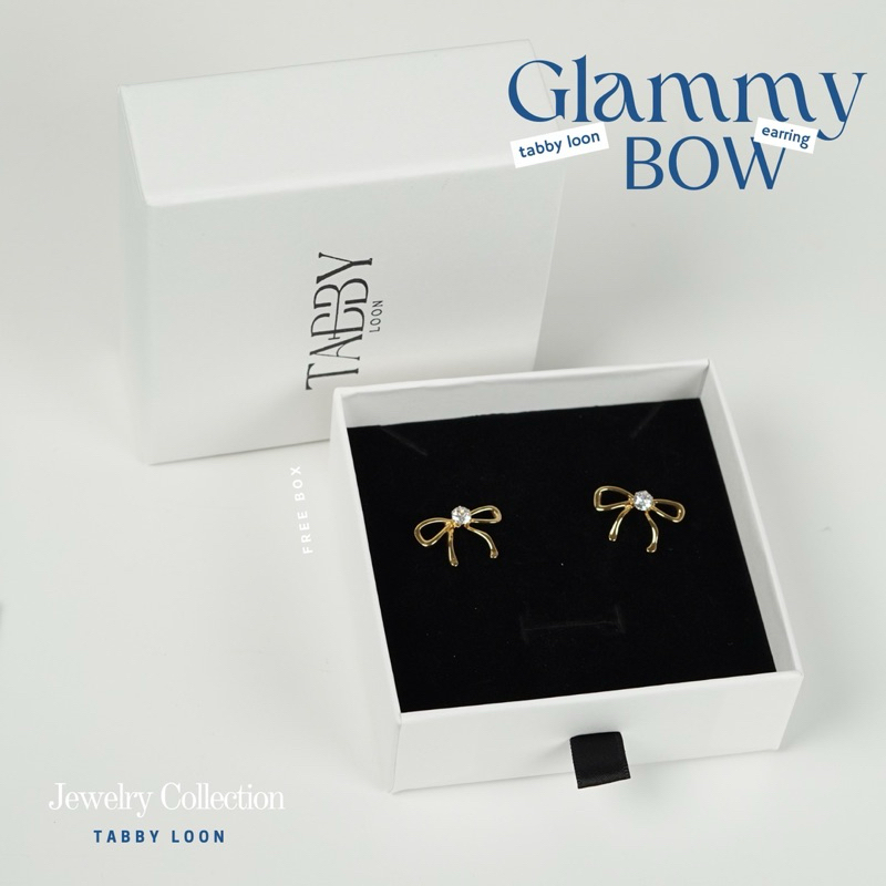 Tabby Loon Glammy Bow Earring ต่างหูริบบิ้นสีทอง ประดับเพรชสีขาว