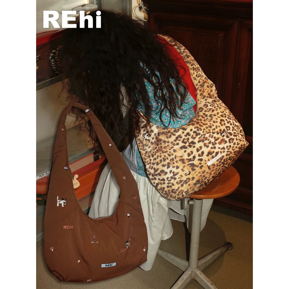 O.Oui I REhi Forest Crossbody bag