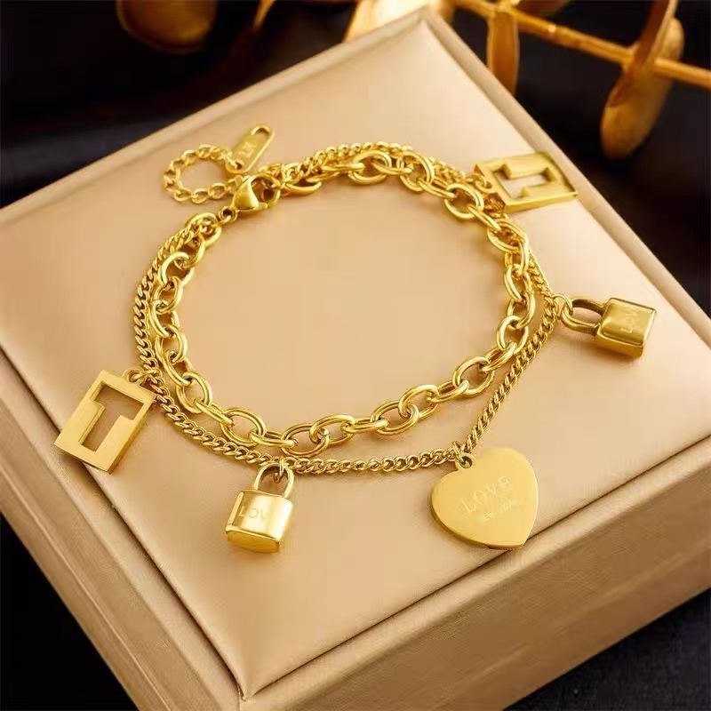 สร้อยข้อมือ 2 ชั้น สีทอง ไทเทเนียม สแตนเลสแท้ 316L สไตล์เกาหลี จี้หัวใจและล็อค ไม่ดำ ไม่ลอกสี CC23