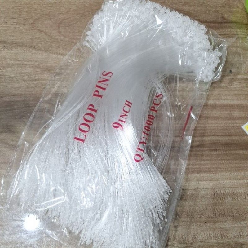 หนวด กุ้ง แบบตุ่ม ขนาดยาว 9 นิ้ว 1 ห่อมี 1000 เส้น เป็นแบบใส สำหรับงานติดราคาเสื้อผ้ากางเกง