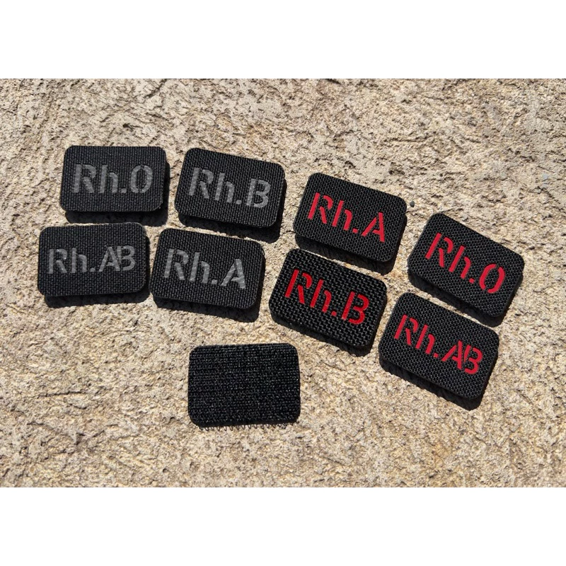 อาร์มกรุ๊ปเลือด Rh.+ สะท้อนแสง ผ้าดำกันน้ำ ขนาด 2*3 cm.