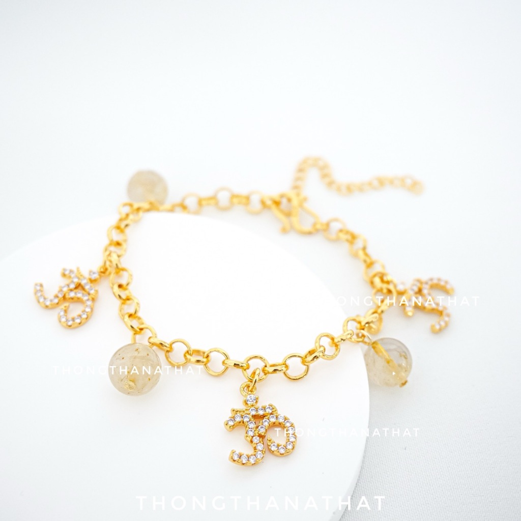 สร้อยข้อมือโอมไหมทอง สายปรับไซส์ เทพเจ้าแห่งความสำเร็จ คิดสมปรารถนา โอม พระพิฆเนศ สร้อยข้อมือโอม ไหมทอง ข้อมือไหมทอง