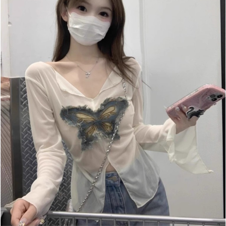 เสื้อเสื้อครอปเสื้อแฟชั่นผู้หญิง  ผีเสื้อสาวฮอตแยกแสงแดดแขนยาวเสื้อยืดผู้หญิงใหม่ปิดเอวแสดงบาง