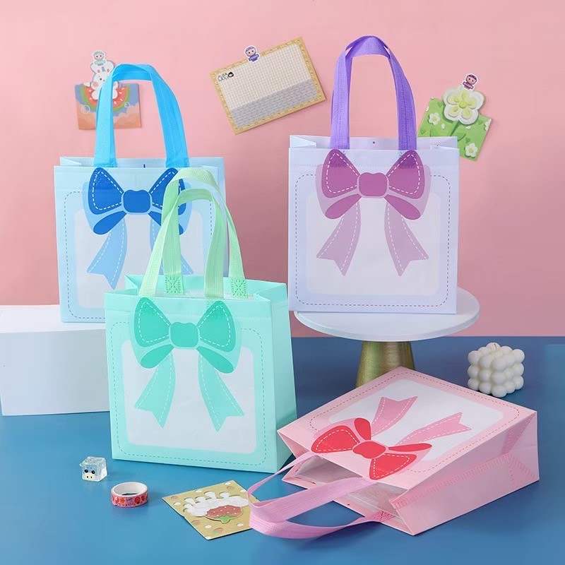 พร้อมส่ง กระเป๋าถือ ถุง มีหูหิ้ว ถุงผ้าไม่ทอ ลายโบว์ วัสดุ พลาสติกเคลือบ สำหรับช้อปปิ้ง