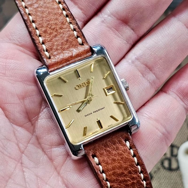 Vintage ORIS golden dial, rectangular shape in stainless steel, manual winding with vintage ORIS cas