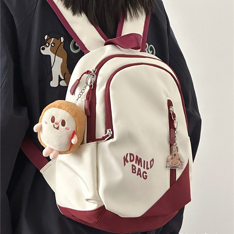 กระเป๋าเป้สะพายหลังที่ทันสมัยกระเป๋านักเรียนอเนกประสงค์ขนาดเล็กสไตล์เกาหลีความจุขนาดใหญ่ส่งจี้สุ่มชายและหญิงทั่วไป