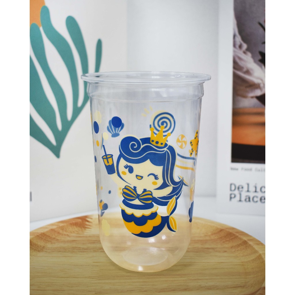 แก้วพิมพ์ลายทรงแคปซูล ตราโฮมคัพ ฝาปิด95 ขนาด22ออนซ์ ยกลัง1000ใบ(50ใบ x 20แถว) **HC-Q22เมอเมดน้ำเงิน*