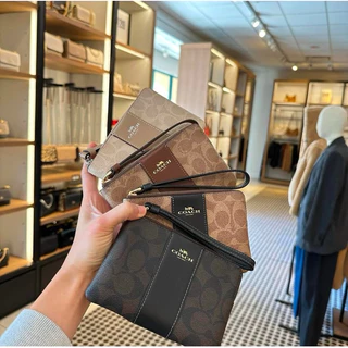 กระเป๋าคล้องมือ รุ่น Corner Zip Wristlet In Signature Canvas มีสีให้เลือก