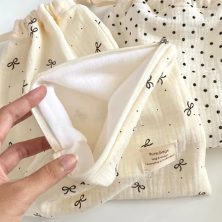 กระเป๋าผ้าลายจุด สีครีมลายจุดดำ โบว์ ผ้านุ่ม ใส่ของใช้จุกจิก รุ่น pokaldot flure.bags