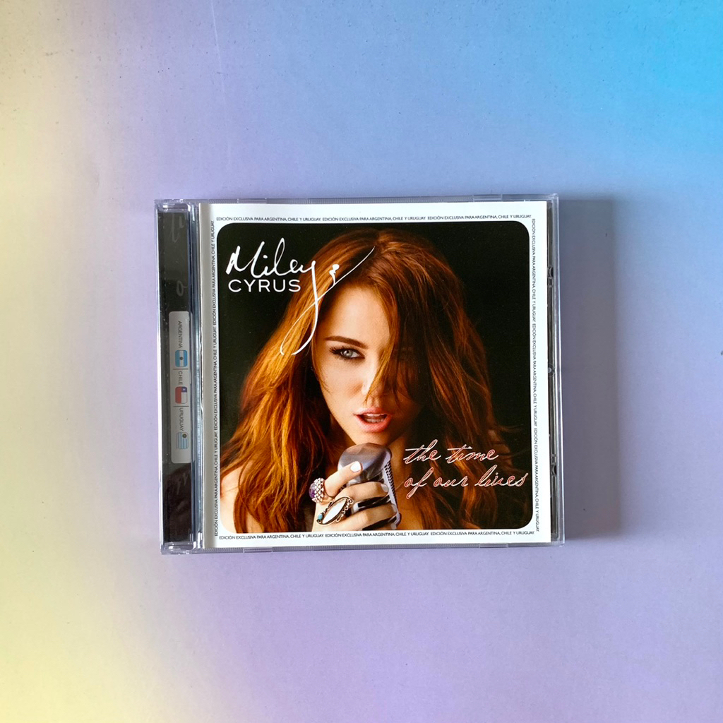 🛒 (พร้อมส่ง) CD ซีดีเพลง: Miley Cyrus — The Time of Our Lives (Argentina edition) [Argentina] x Jona