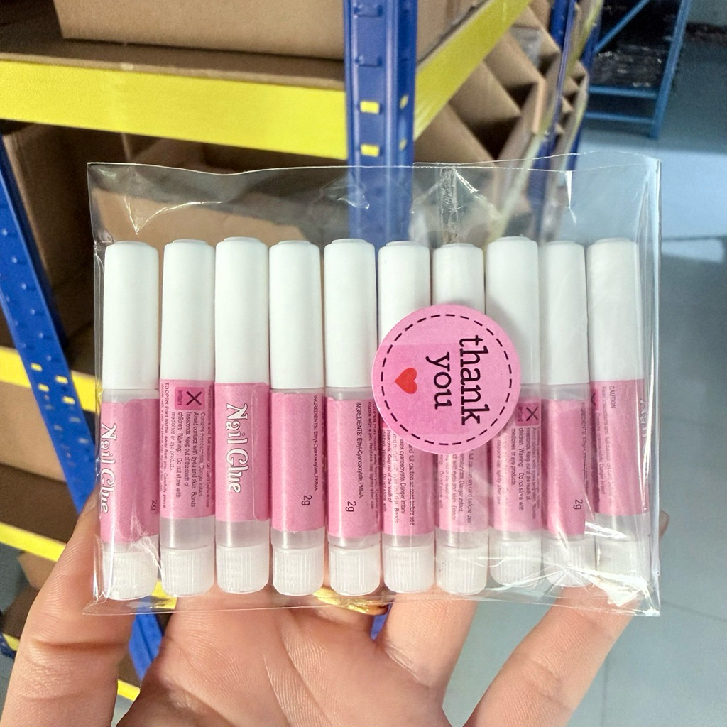 กาวหลอดชมพูติดเล็บปลอม ขนาด 2 g (10 หลอด)