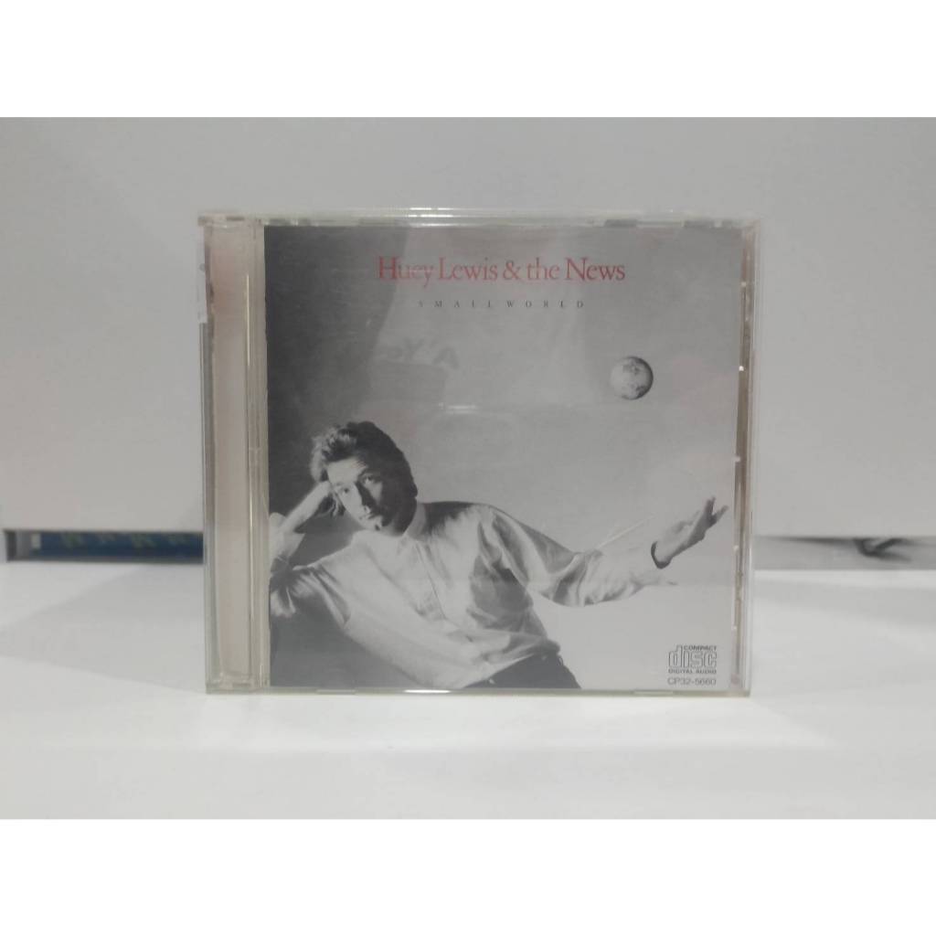 1  CD MUSIC ซีดีเพลงสากล "Small World" Huey Lewis & the News  (C4D56)
