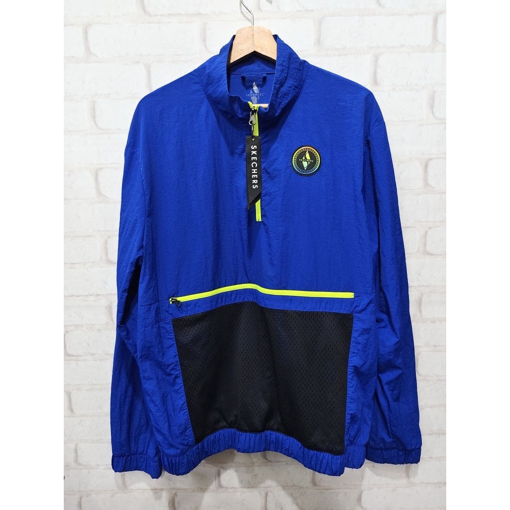 (Q23) เสื้อแจ็คเก็ต Skechers รุ่น Goalkeeper Anorak สีน้ำเงินสะดุดตาพร้อมกระเป๋าหน้าอกซิปสีเหลืองนีอ