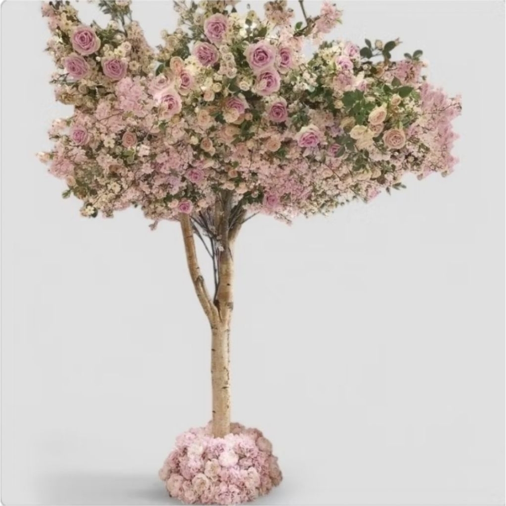 Real tree decorated with rose bushes
