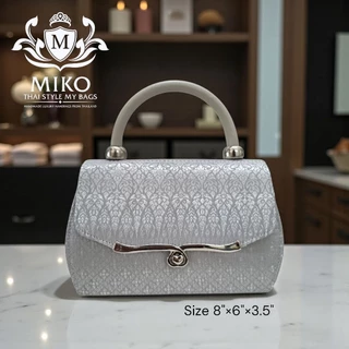 Miko กระเป๋าถือ สีบรอนซ์เงิน และสีออฟไวท์ สีขาว ผ้าไทย