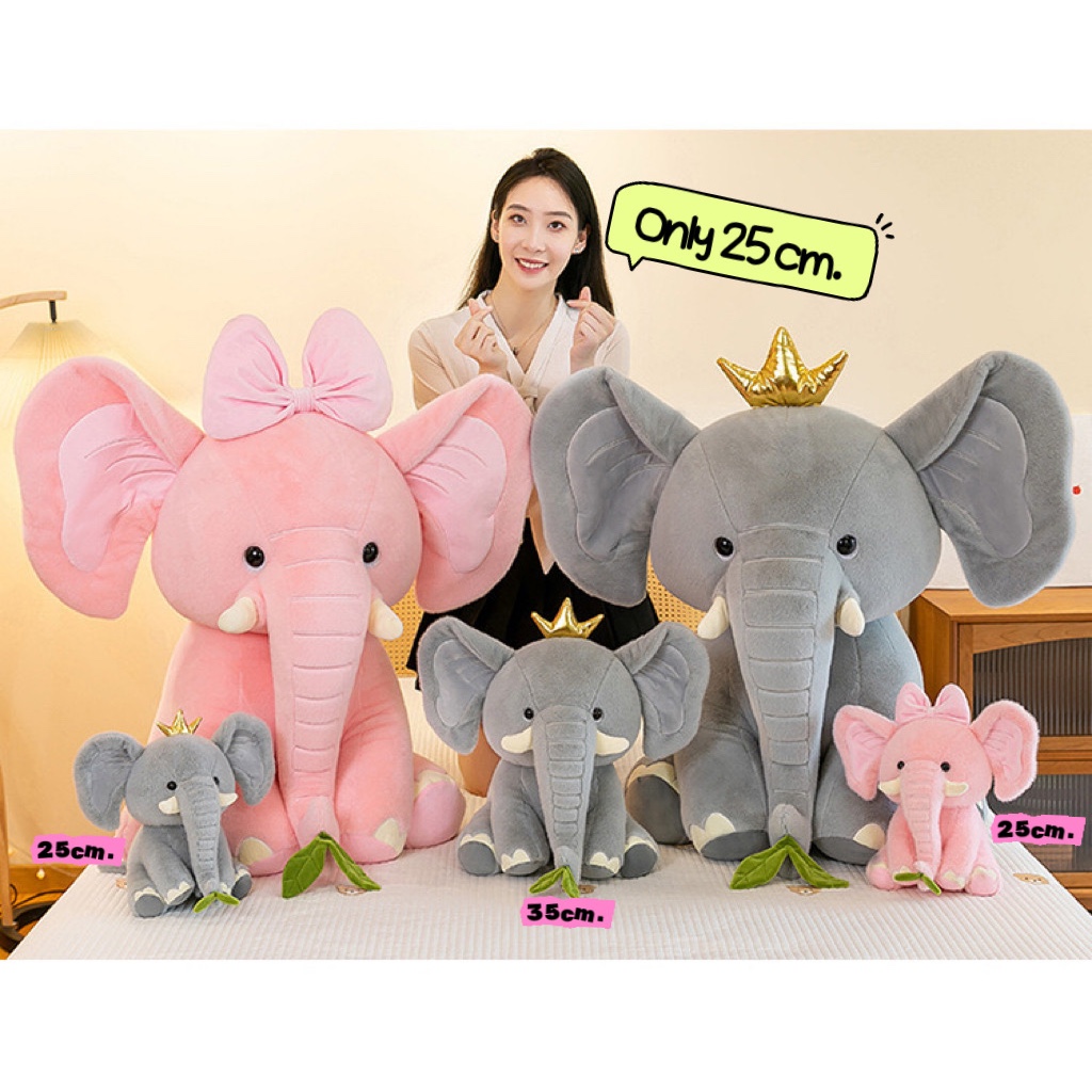 ตุ๊กตาช้างมีมงกุฎ ผูกโบว์ชมพู  แบบนั่ง น่ารัก ขนนุ่ม สีสวย ขนาด 25ซม. ให้เป็นของขวัญ ของฝาก ของชำร่วย ตามที่ต้องการ คุณภ